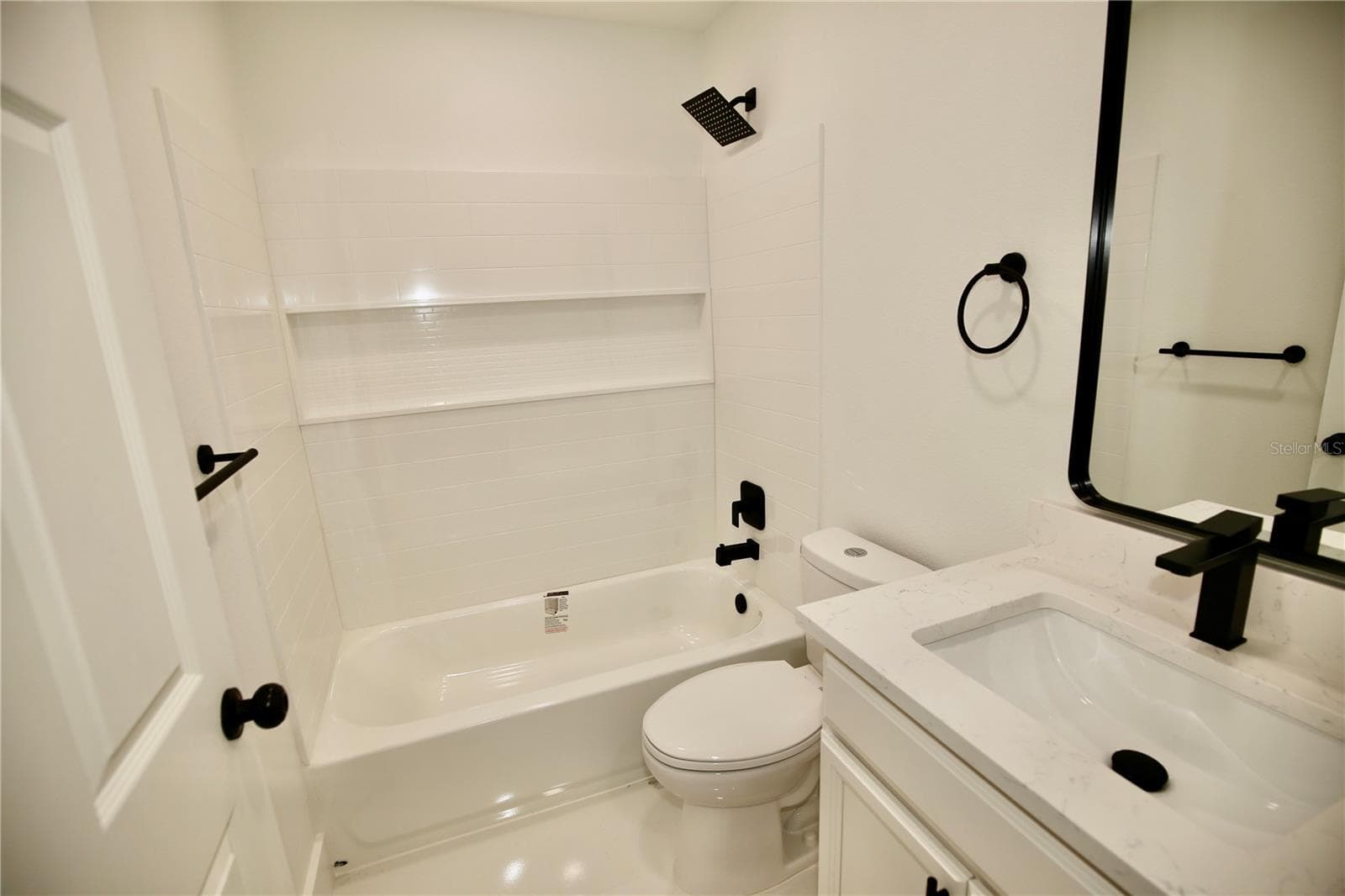 Second Bath. Porcelain floors with Quartz counters. - 2235 WAUTOMA PL, ORLANDO