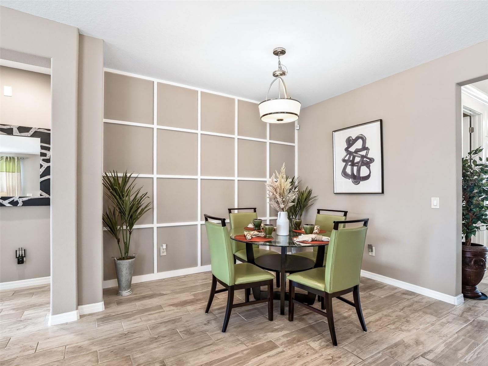 Eat-in Kitchen with custom trim detailing the wall. - 5662 NW 40TH LOOP, OCALA