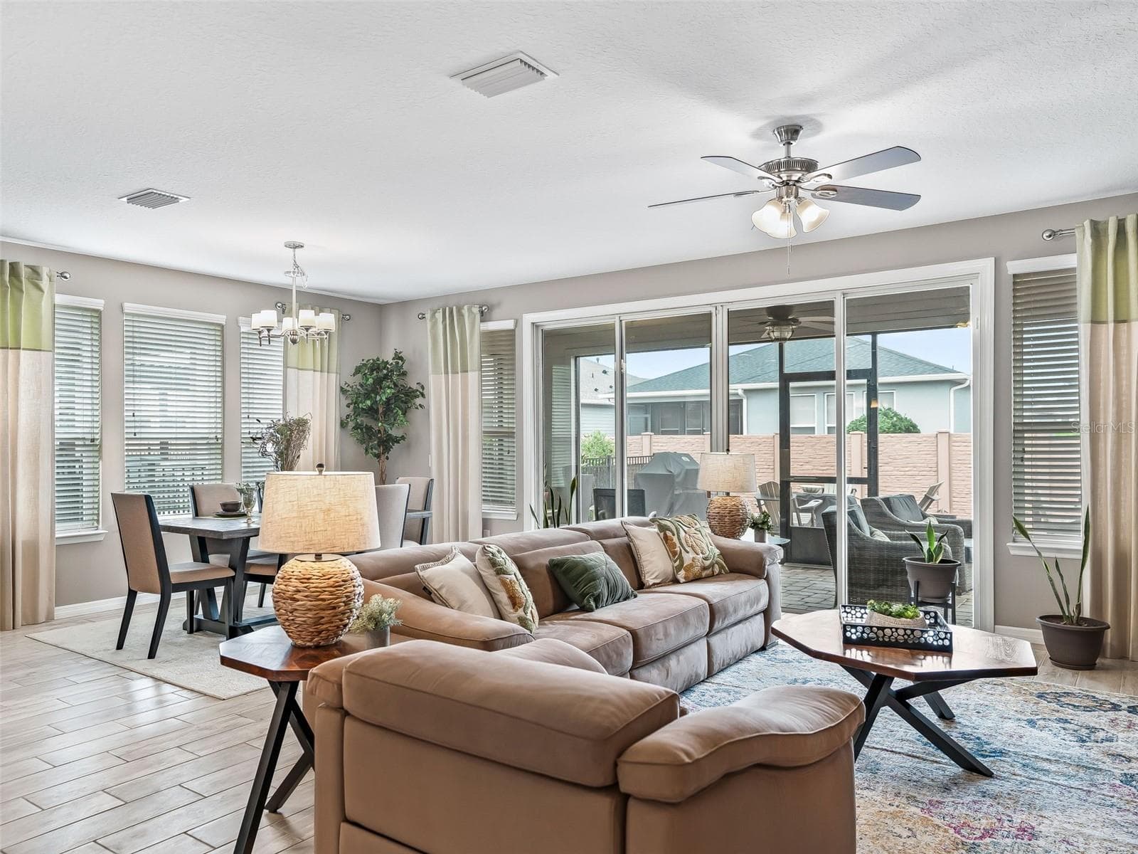 Beautiful sliding doors lead to your covered lanai - 5662 NW 40TH LOOP, OCALA