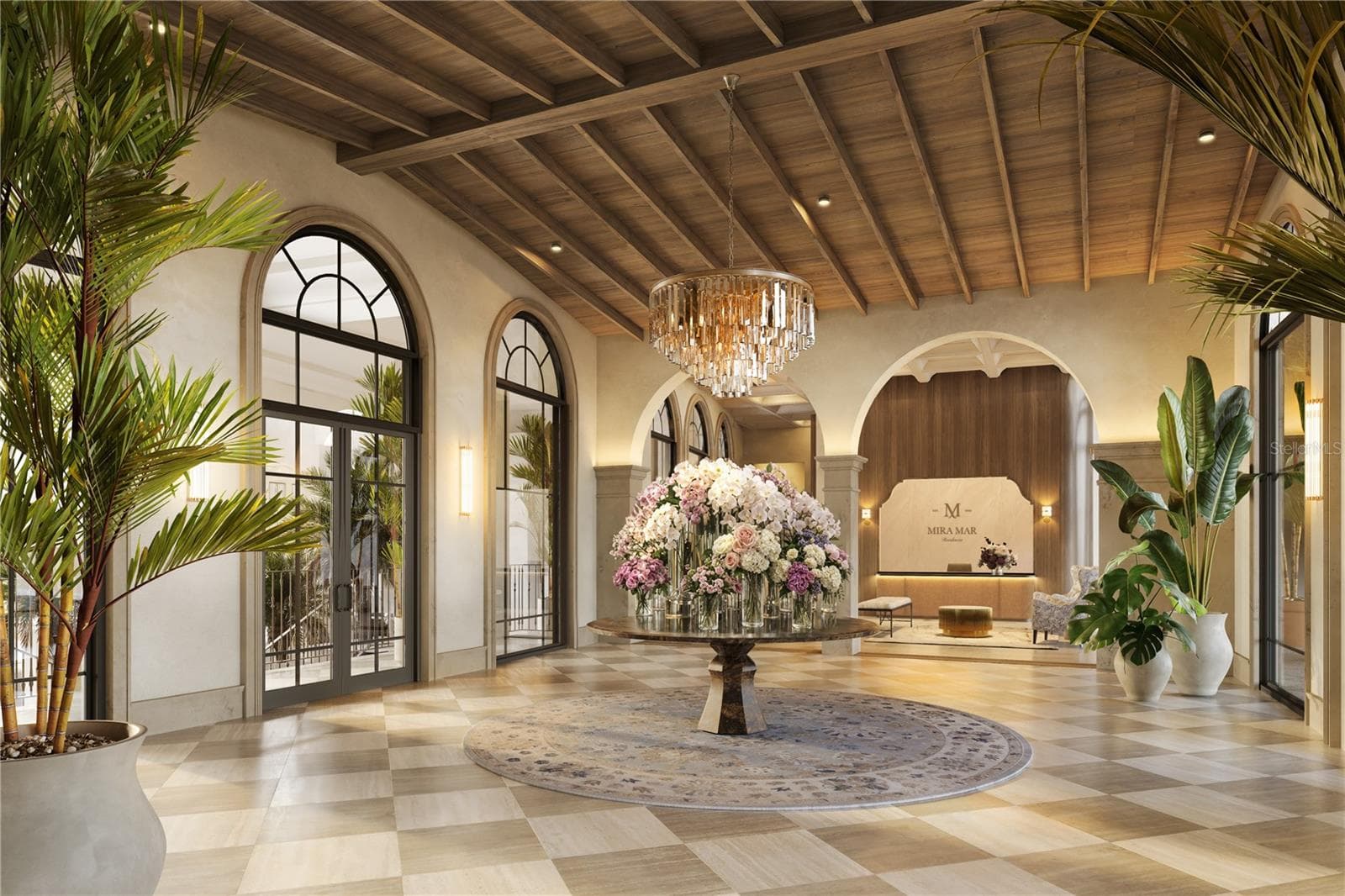 The Grand Lobby at Mira Mar offers a refined arrival experience, overlooking a beautifully landscaped courtyard and showcasing timeless architecture, natural light, and sophisticated finishes. - 65 S PALM AVE #1205, SARASOTA