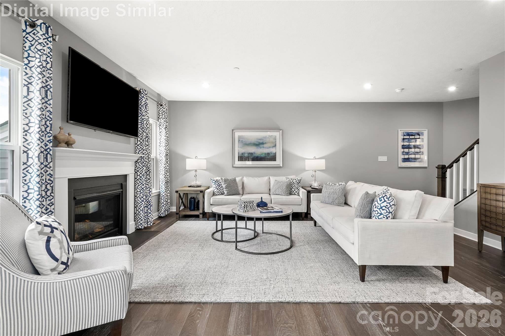 Elegant great room flooded with natural light from two oversized windows, perfect for entertaining or relaxing. Optional fireplace adds warmth and charm to this inviting space. - Charlotte