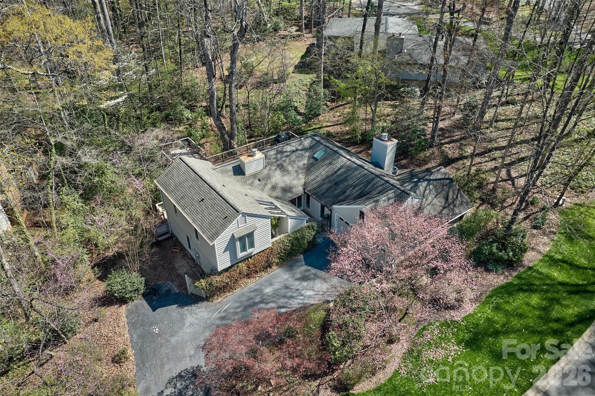 Home is surrounded by mature landscaping for added privacy - Lake Wylie