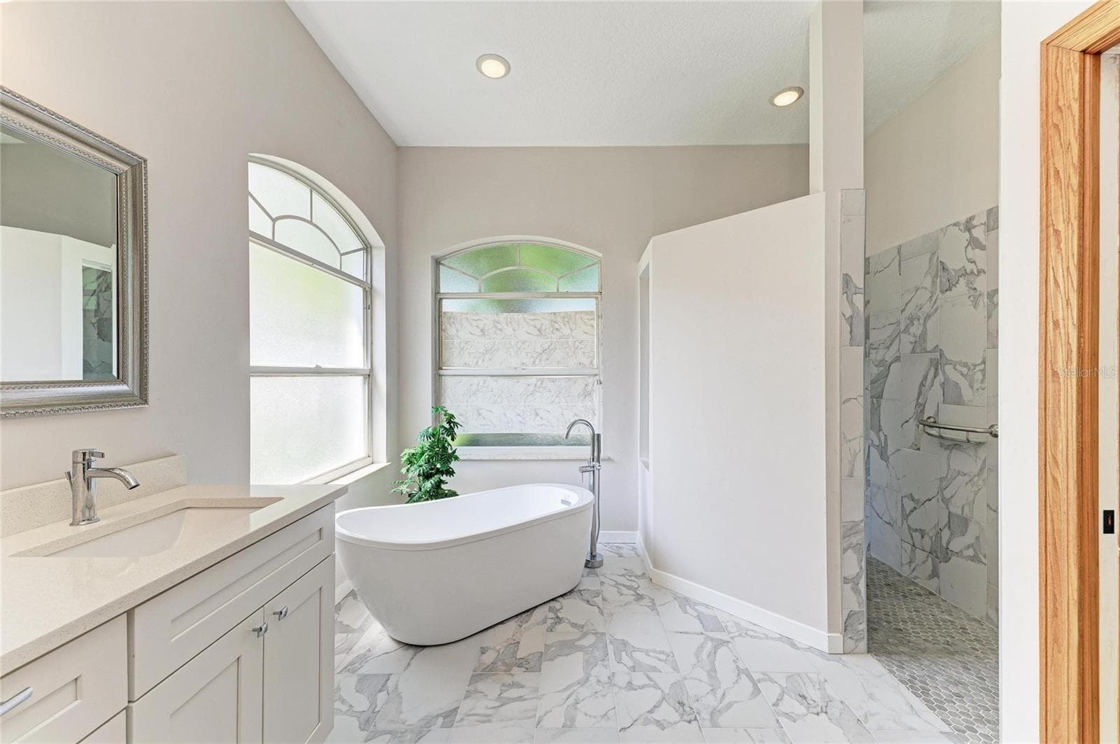 Walk-In shower with smooth transition without a ledge or step - 7604 52ND TER E, BRADENTON
