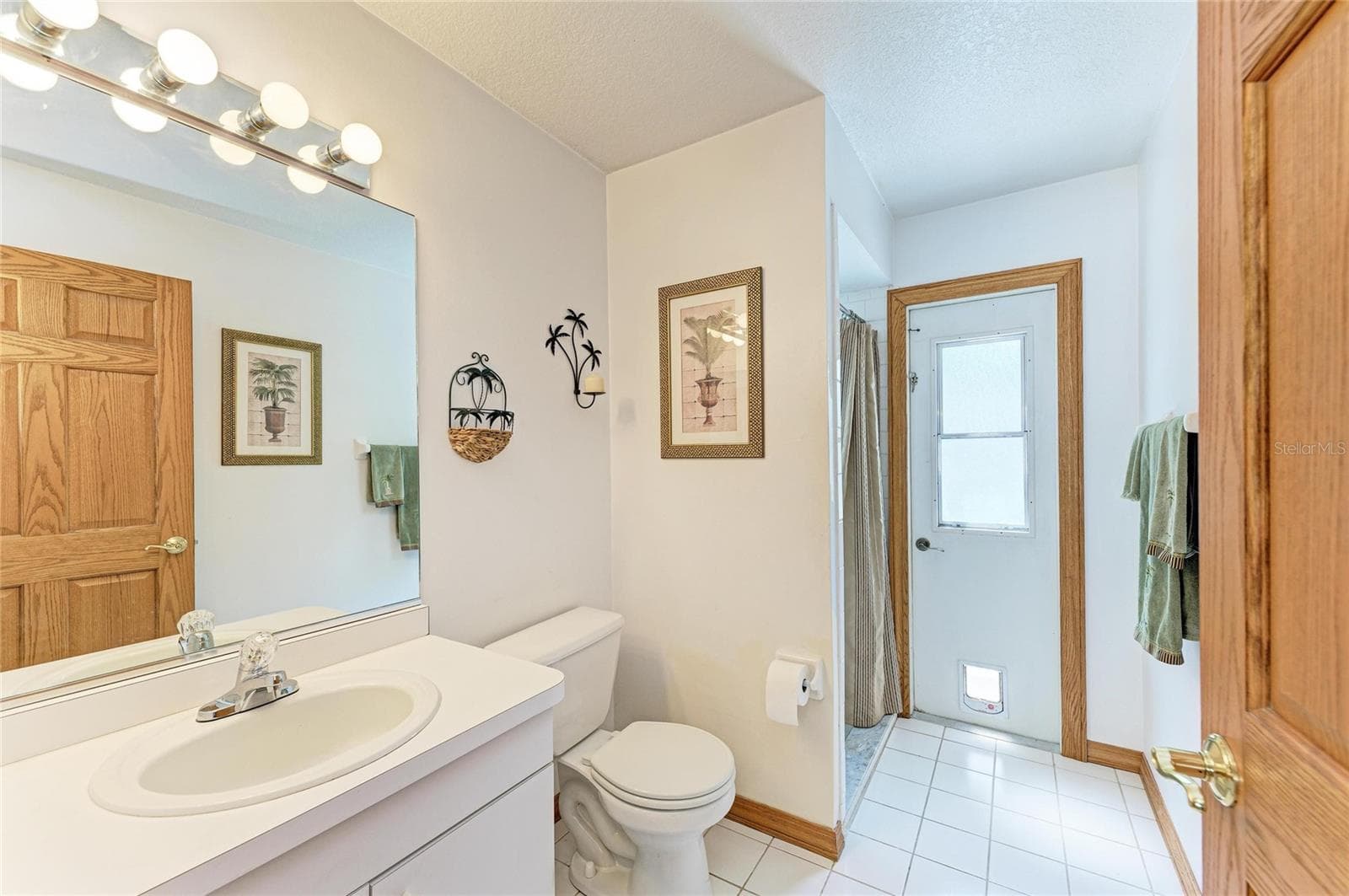 3rd Bathroom with pool door access. - 7604 52ND TER E, BRADENTON