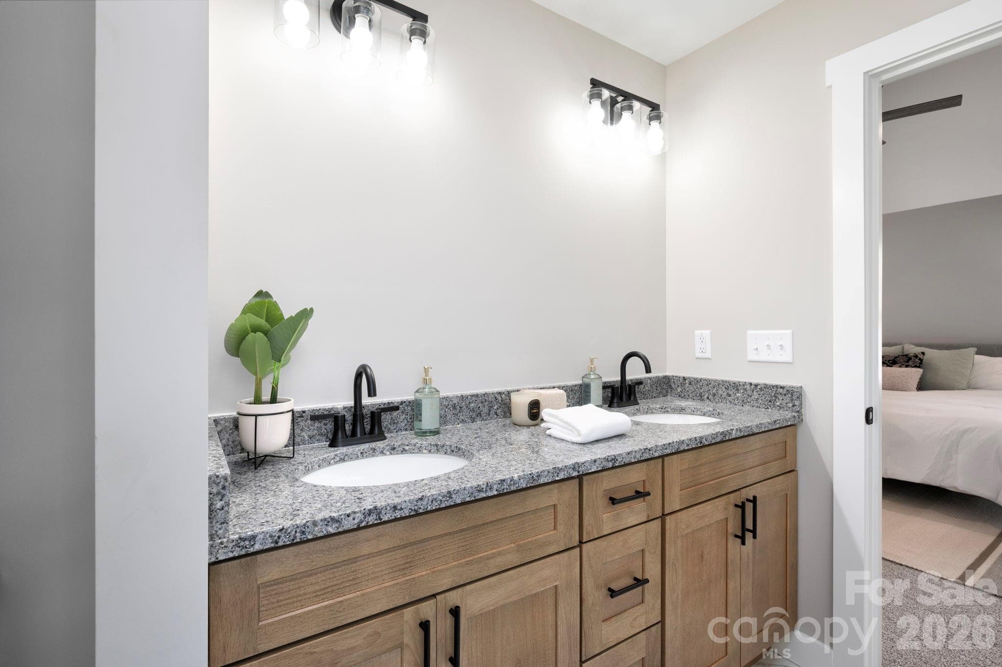 Dual Vanity with Granite Countertop and Woodgrain Cabinets - 9 Myrtle Lee Cove, Arden