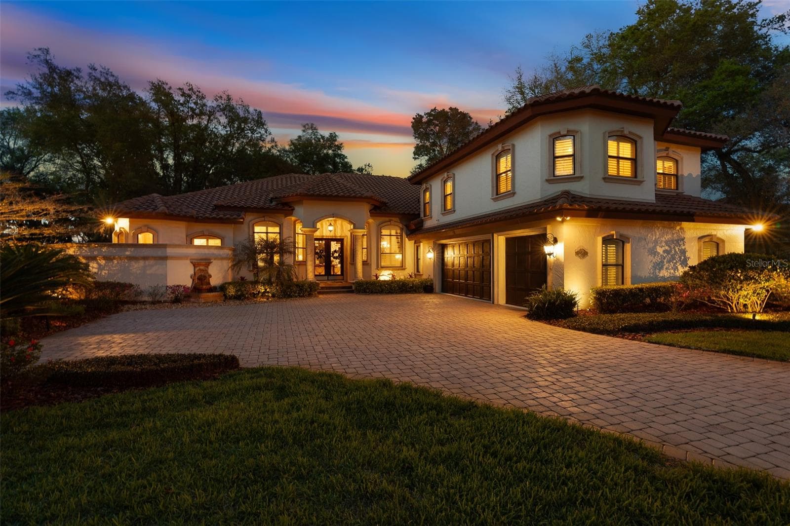 Twilight Driveway View - 7341 BELLA FORESTA PL, SANFORD