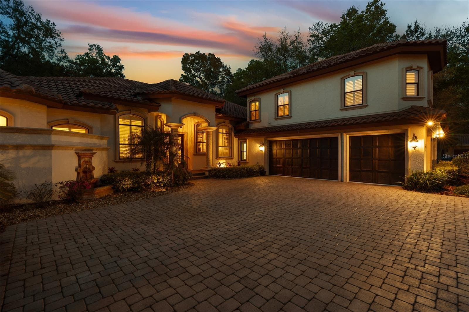 Twilight Driveway View - 7341 BELLA FORESTA PL, SANFORD