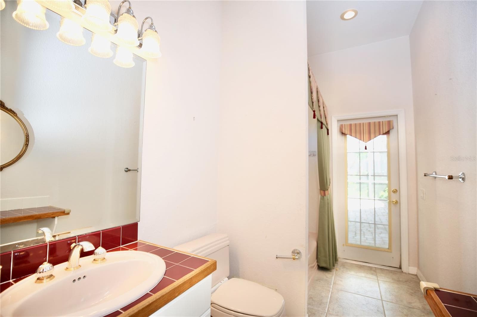 3rd bedroom bathroom with full tub and shower - 2686 CRYSTAL CIR, DUNEDIN