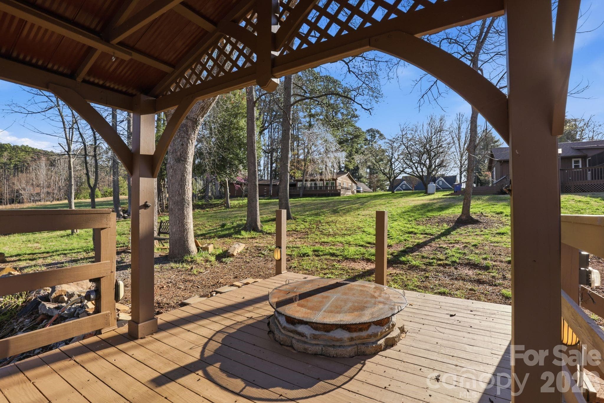 View from landing area with fire pit towards building envelope. - Troutman
