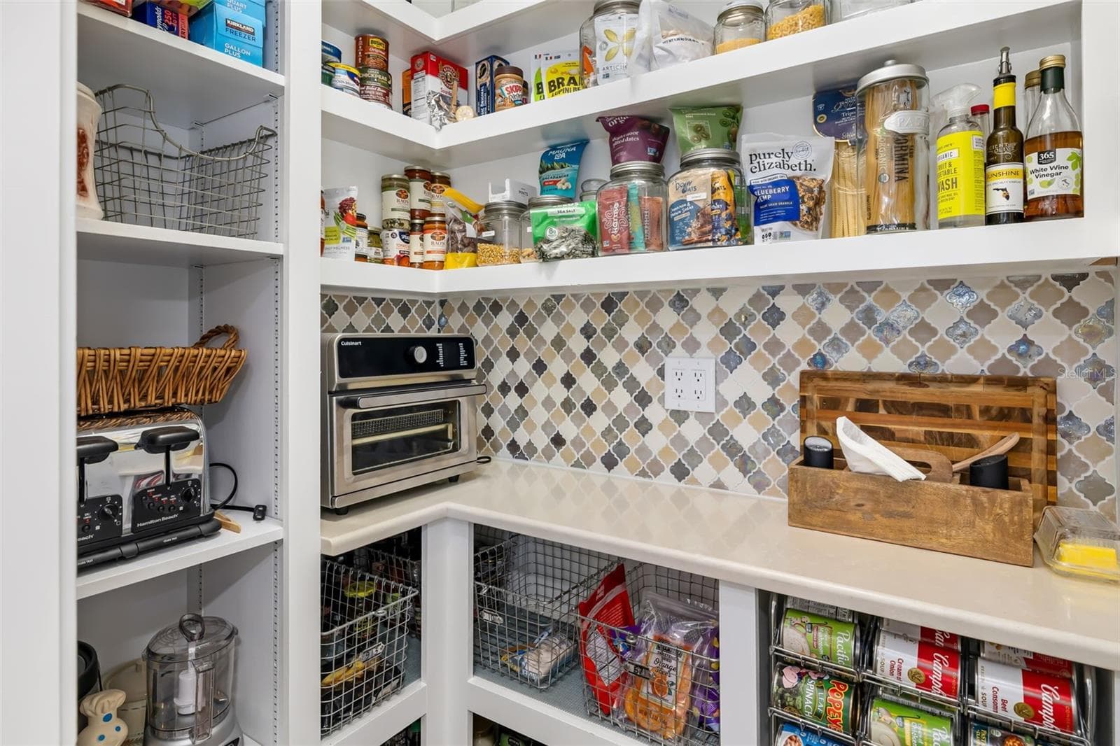 Organized Pantry with beautiful backsplash - 10107 CARNOUSTIE PL, BRADENTON