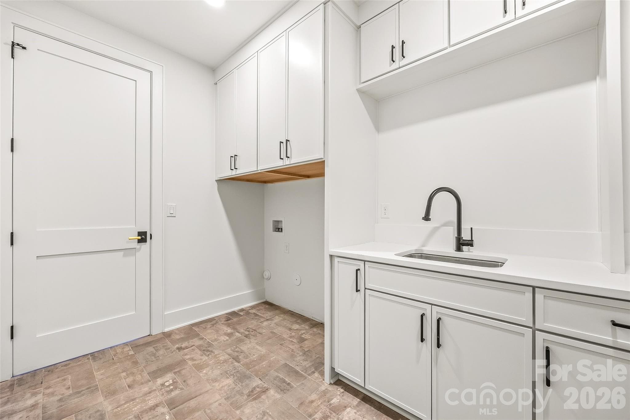 Laundry room, attached to call and primary bedroom - 7109 Essington Drive, Charlotte