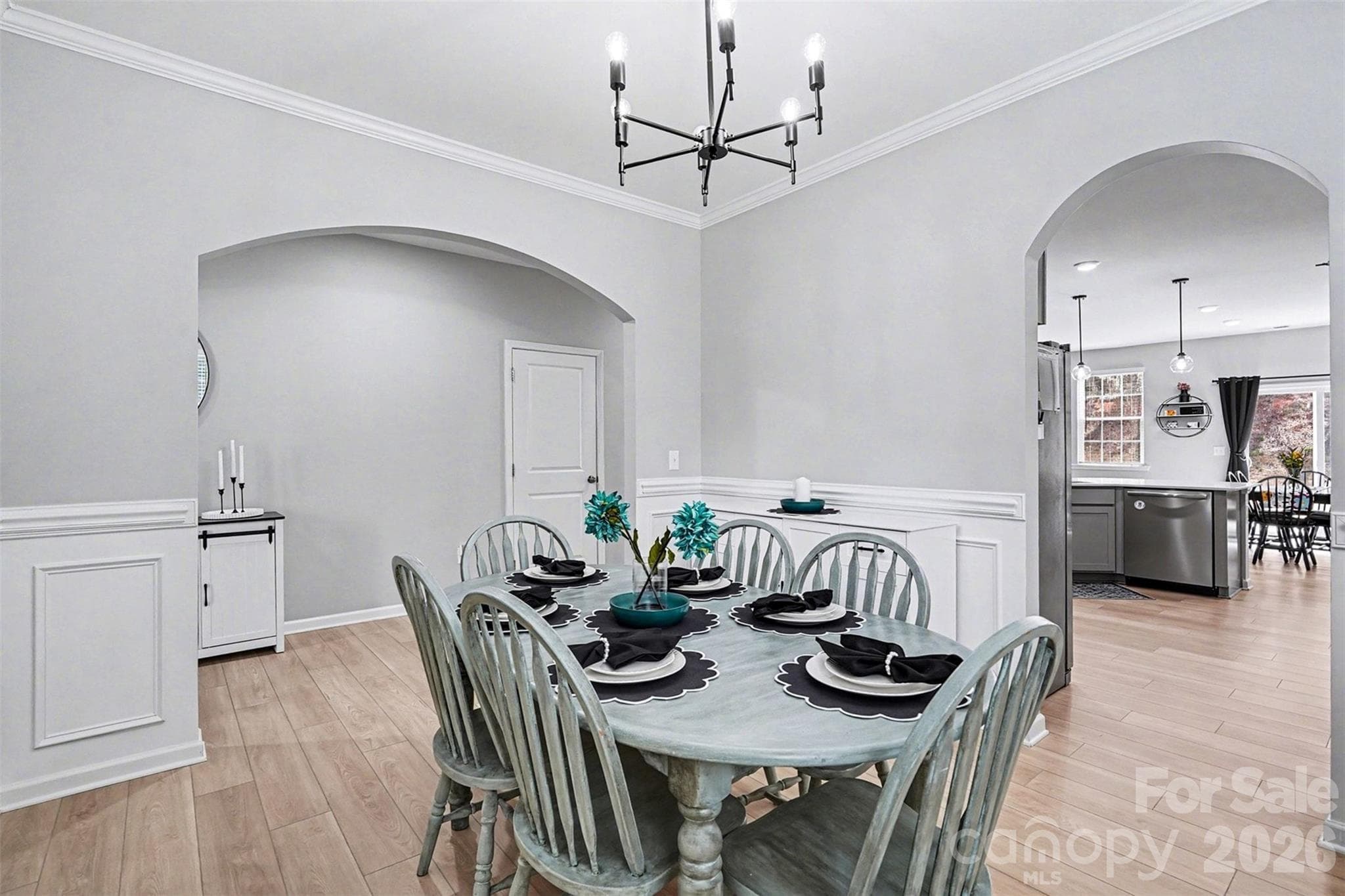 Formal dining connects to kitchen - 310 Hamptons Cove Road, Troutman