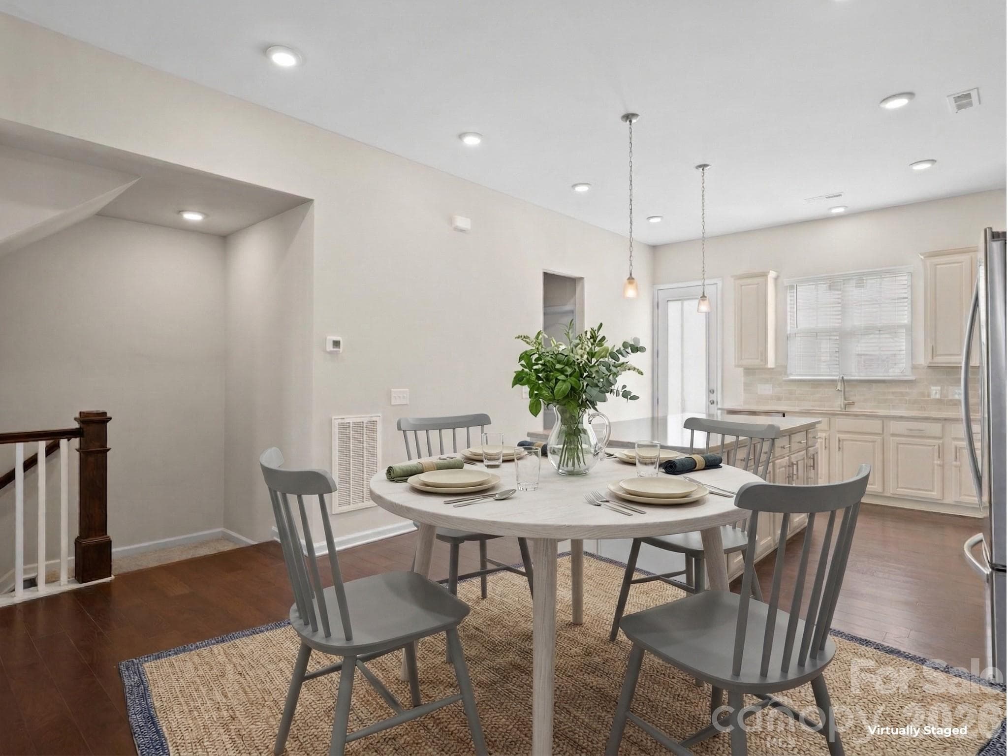 Upper floor/2nd floor includes the large kitchen, dining area, and living room. - Charlotte