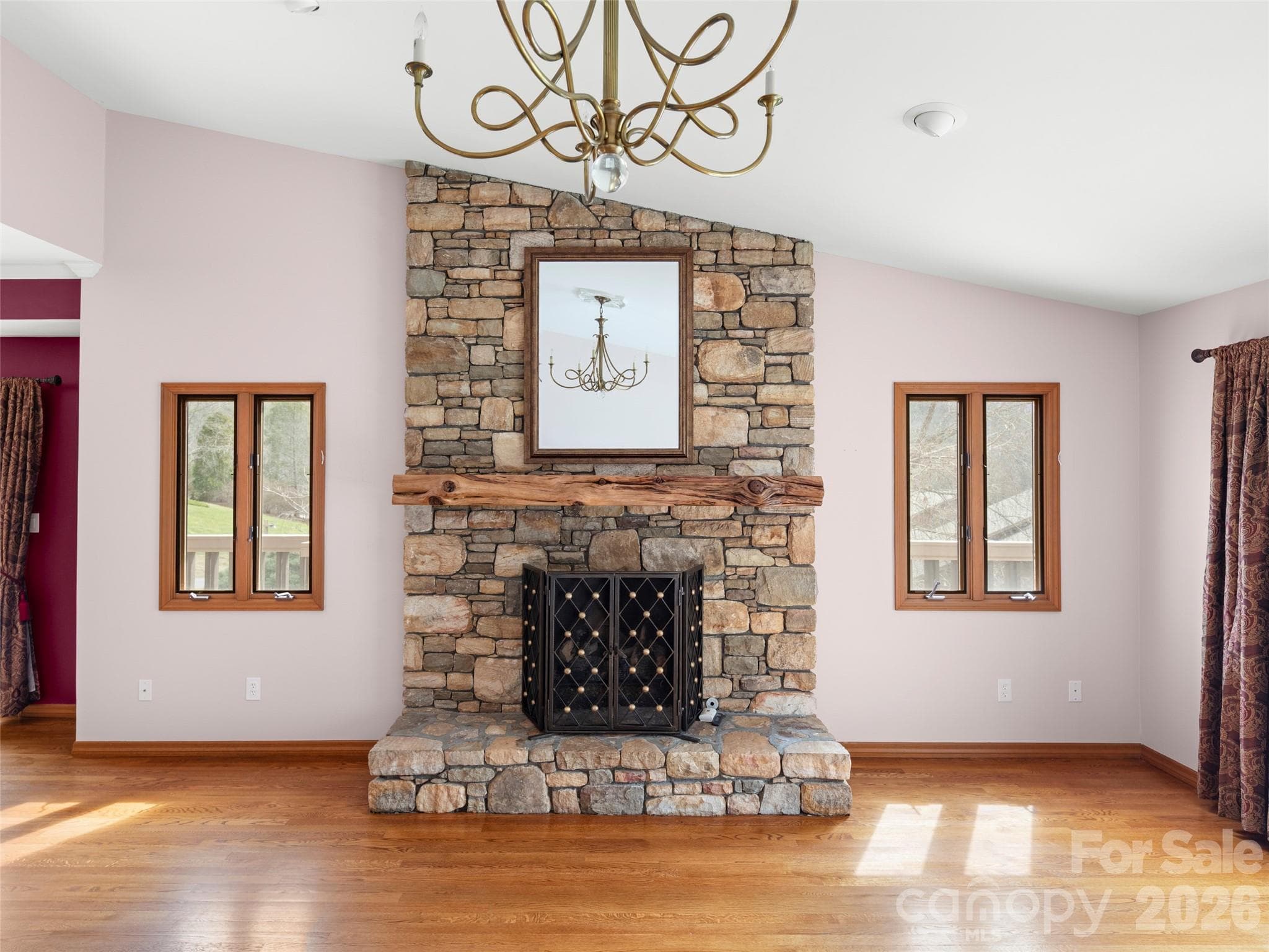 Locally crafted mantle atop the stone fireplace - Asheville