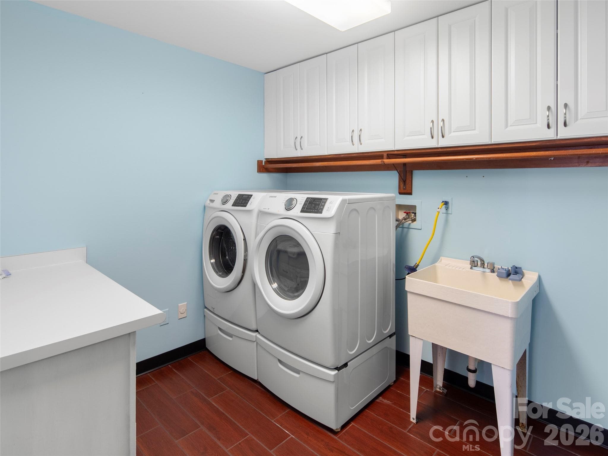 Large laundry with ample storage and folding table - Asheville