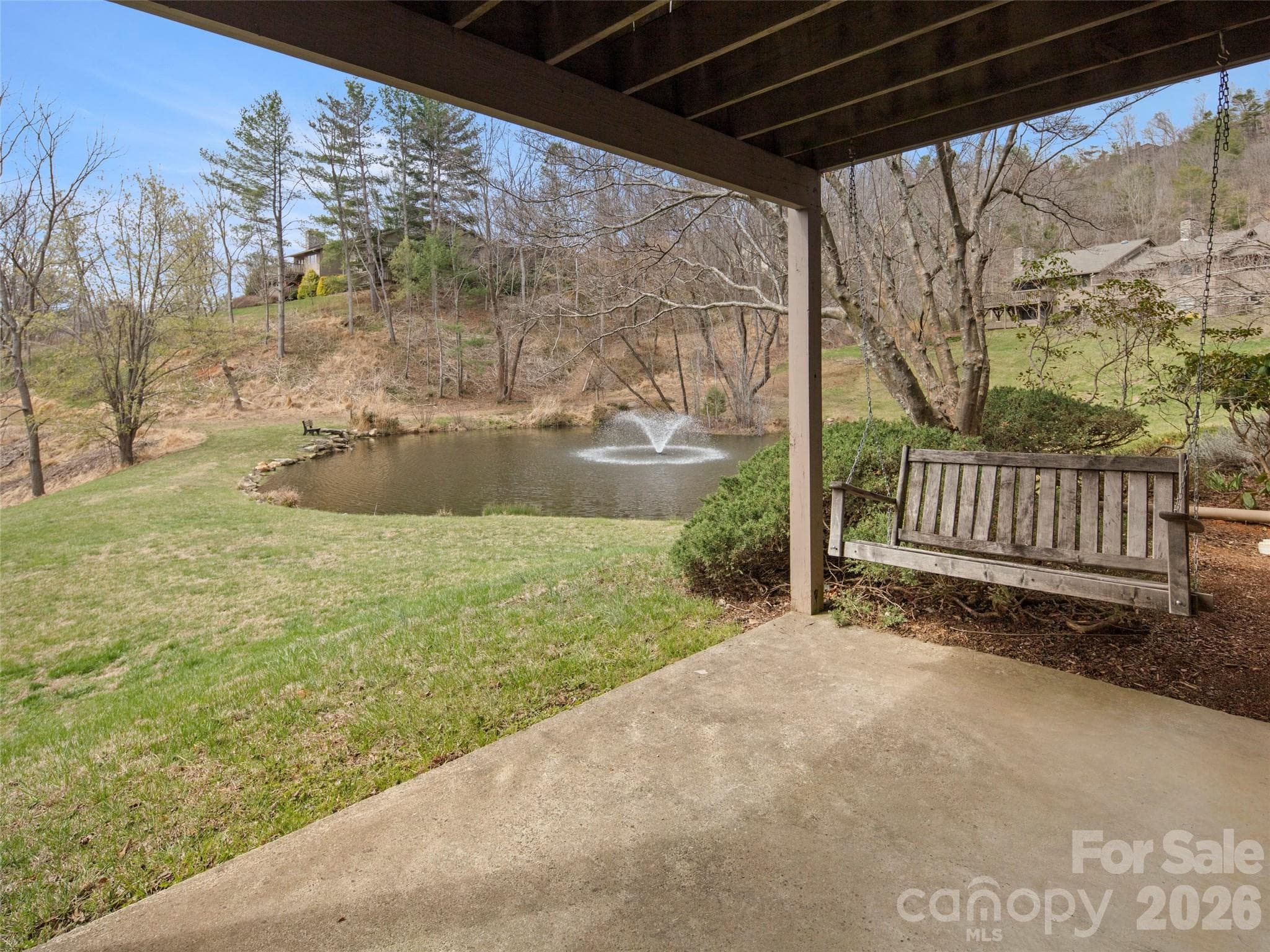 Terrace level view of community pond with water feature - Asheville