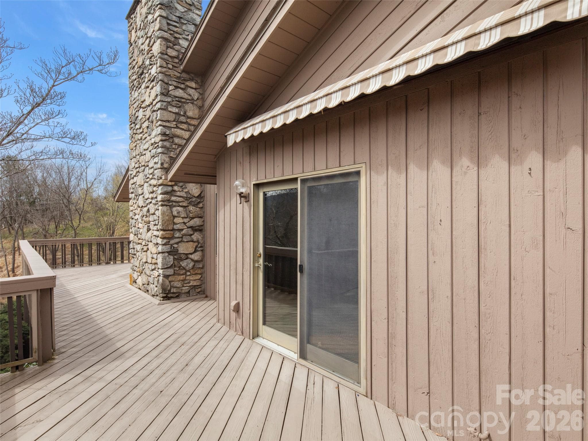 Wraparound porch with awning perfect to look to the east at mountains as you enjoy breakfast outside - Asheville