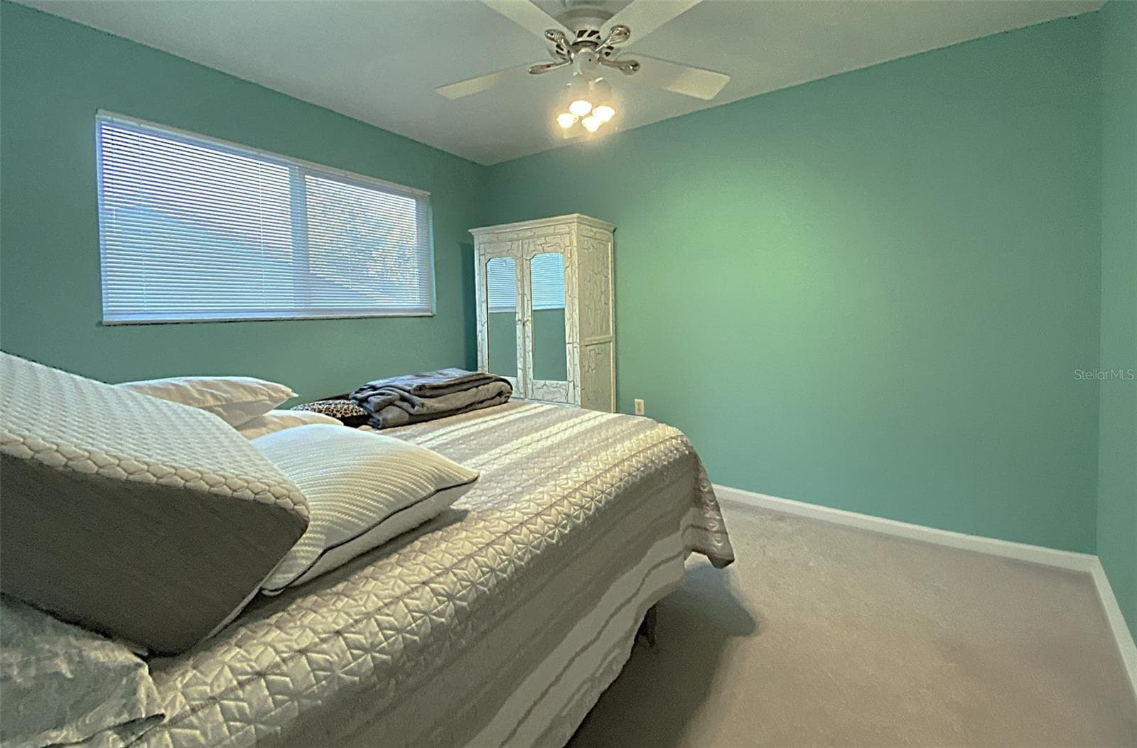 Bedroom 2 measures 11'x11' has carpet, ceiling fan and single closet - 626 ORCHID LN, ALTAMONTE SPRINGS
