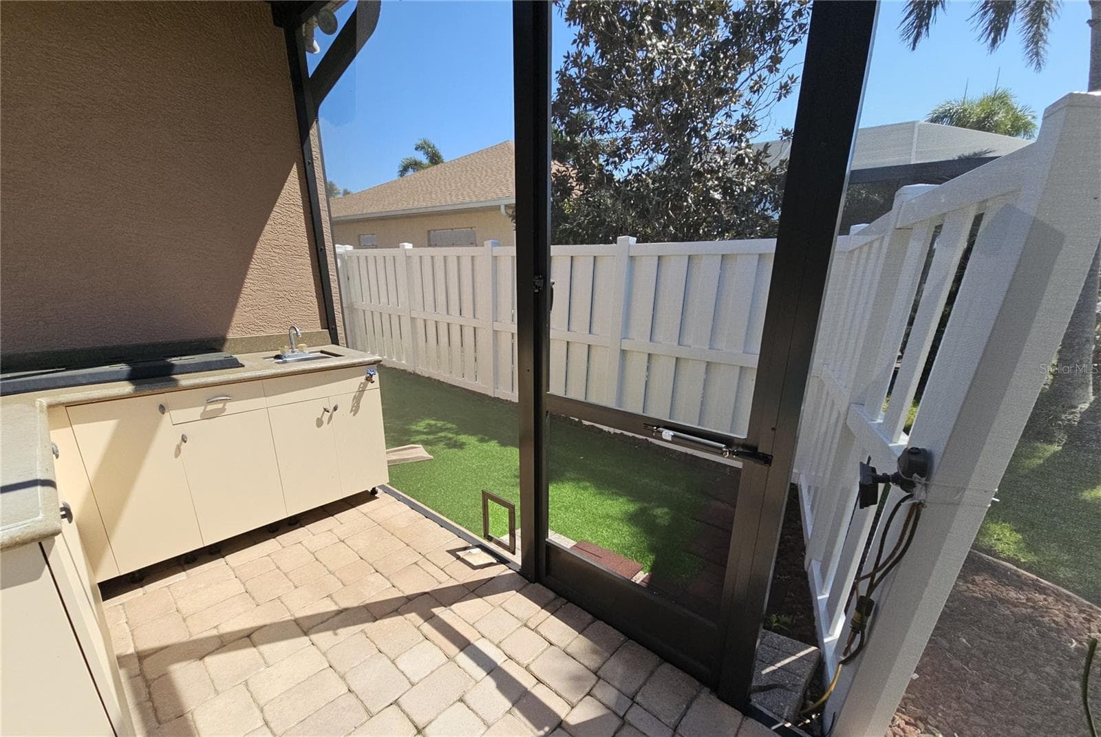 Doggie Door for Dog Run - 566 PLANTERS MANOR WAY, BRADENTON