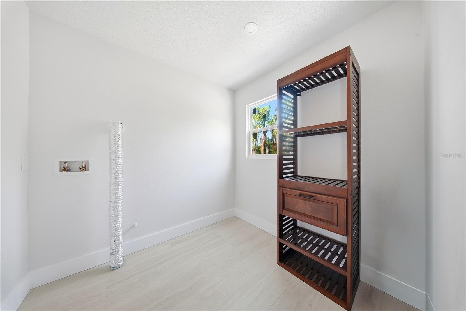Primary Bedroom Walk-In Closet w/WD Hookups - 1109 CHARLES ST, CLEARWATER