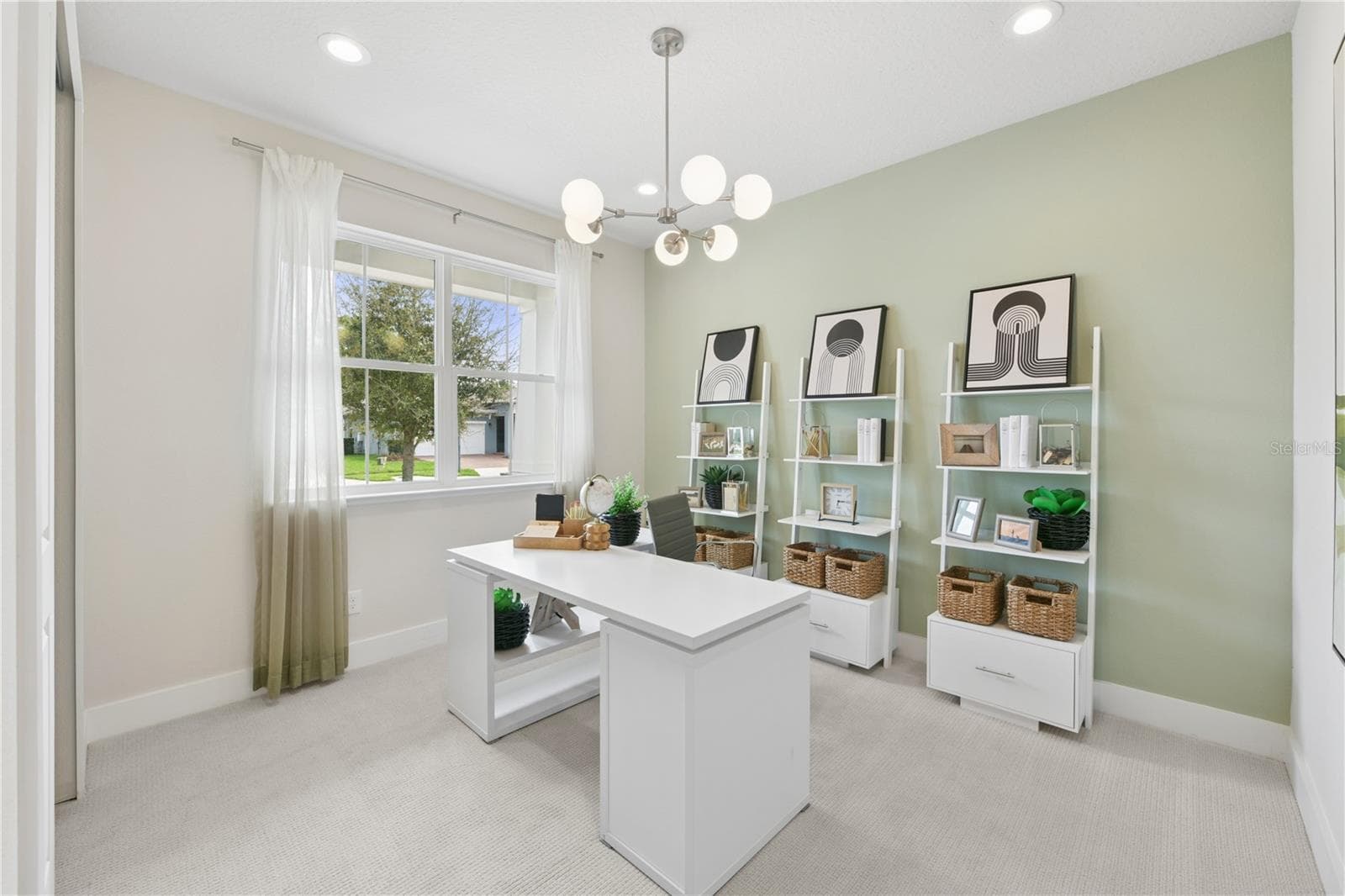 Second bedroom (staged as an office space) with a built-in closet and ample natural light - 2418 PARK RIDGE ST, APOPKA