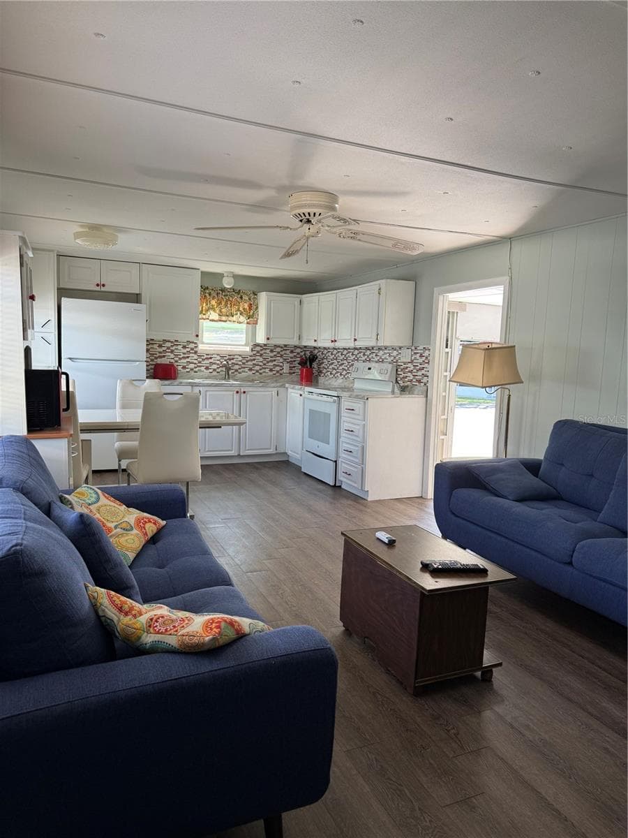 living room into kitchen - 7803 46TH AVE N #129, ST PETERSBURG