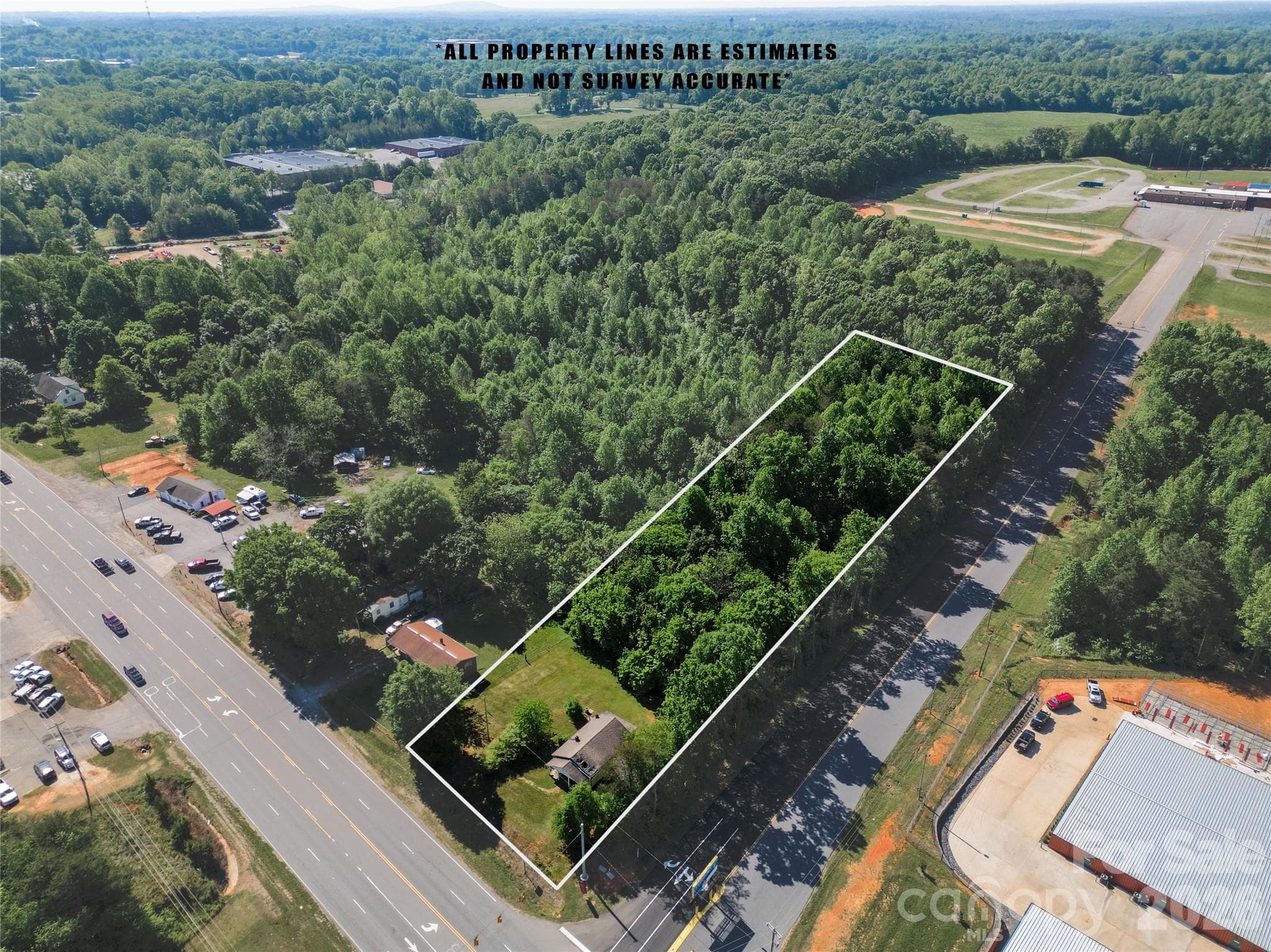 Infill corner lot on busy four land corridor and business district. - 1123 US 70 Highway, Newton