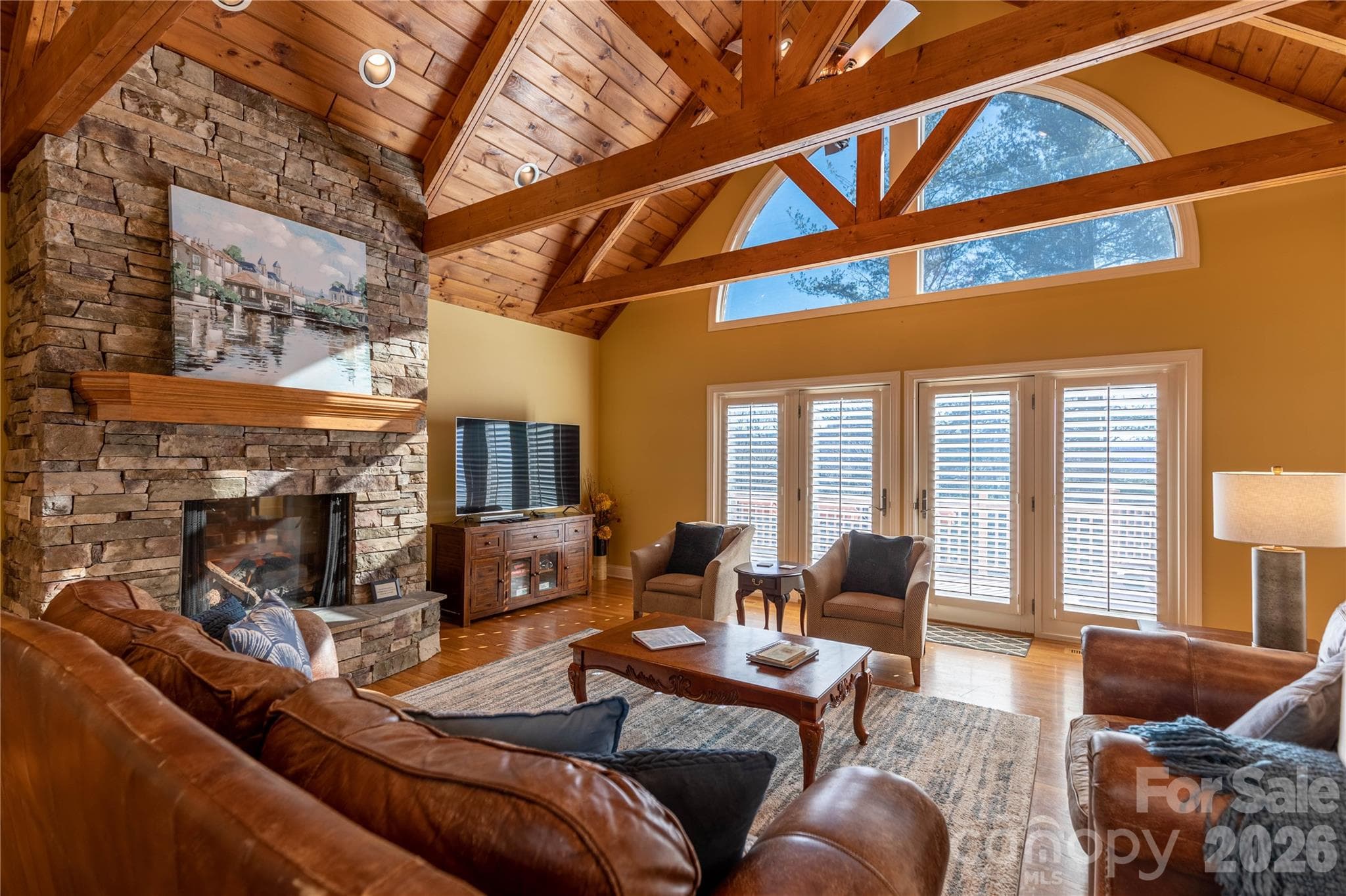 Fabulous family room has real wood cathedral ceiling with handsome beams and paladium windows for lots of natrual light. - 446 Windridge Drive, Sugar Grove