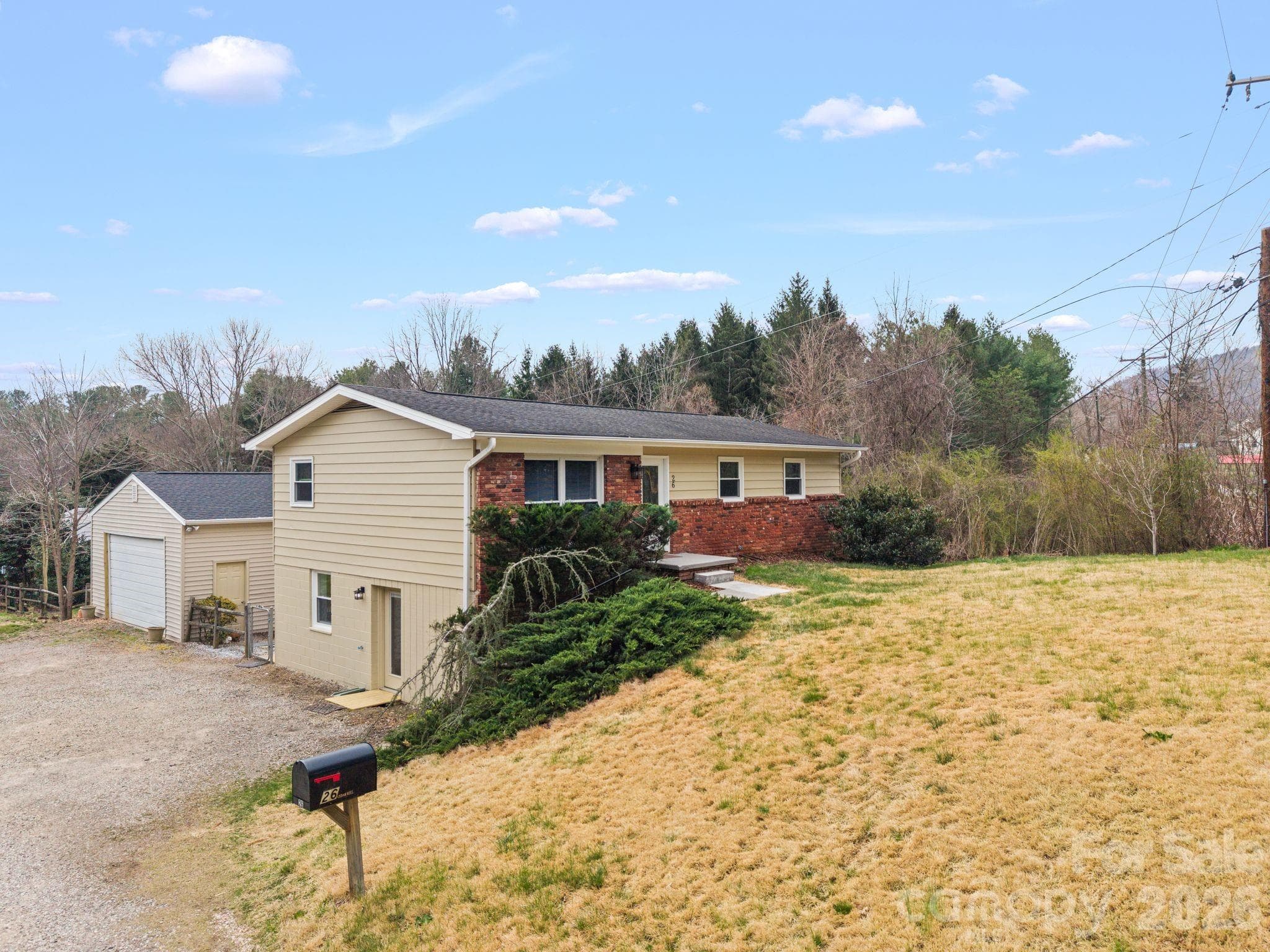 Front view of home showcasing large detached garage. - Asheville