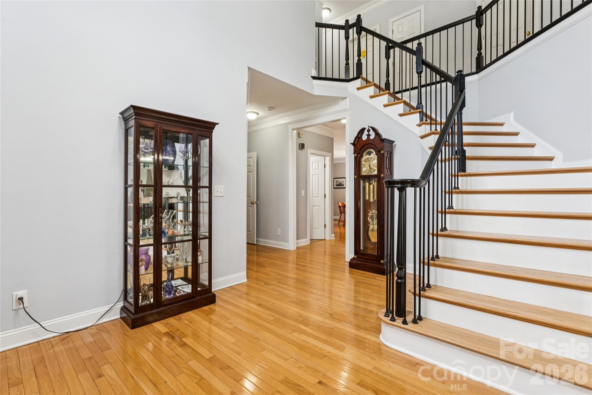 Soaring two-story foyer with hardwood flooring AND stairs. - 2678 Landing Pointe Drive, Clover