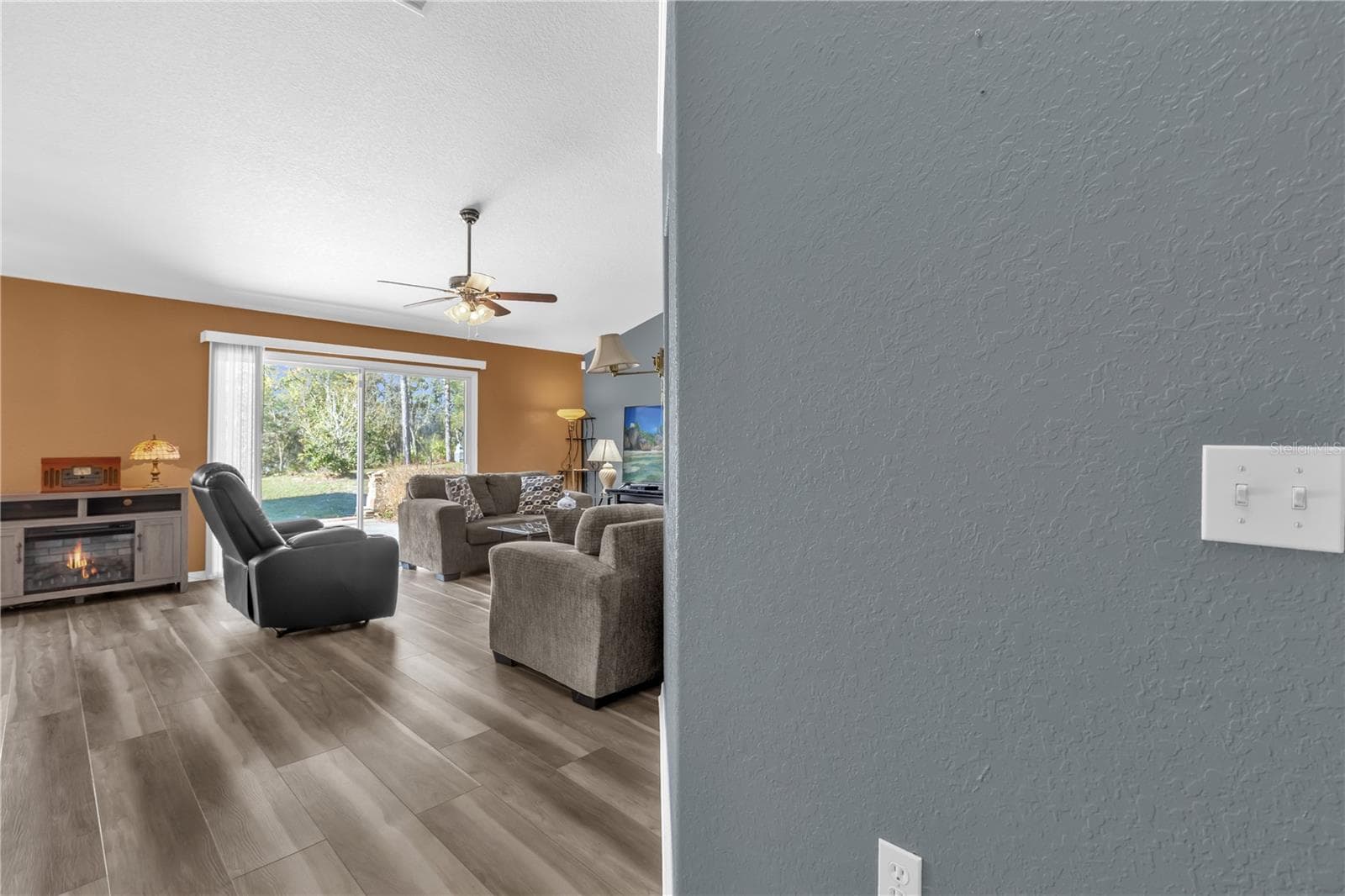 Living room view from kitchen - 8506 SW 136TH LOOP, OCALA