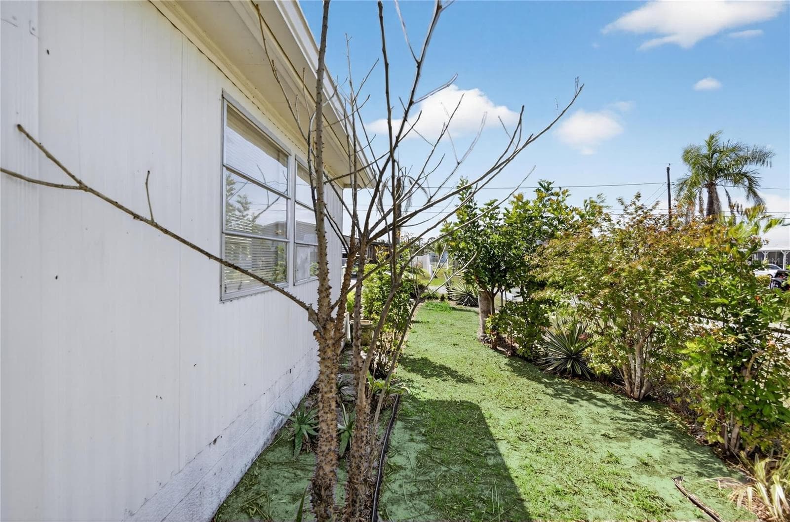 Side of Subject Property - 1349 SEAGULL DR, ENGLEWOOD