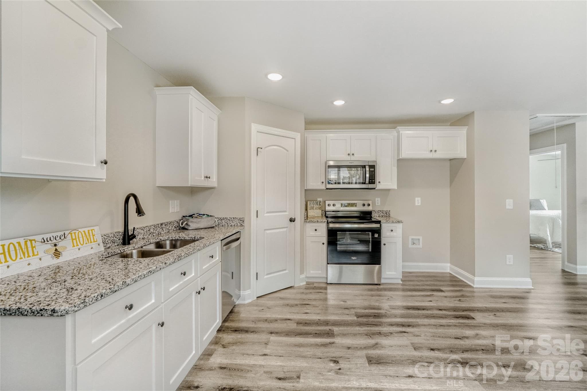Granite countertops, modern white cabinetry and stainless steel appliances - Kannapolis