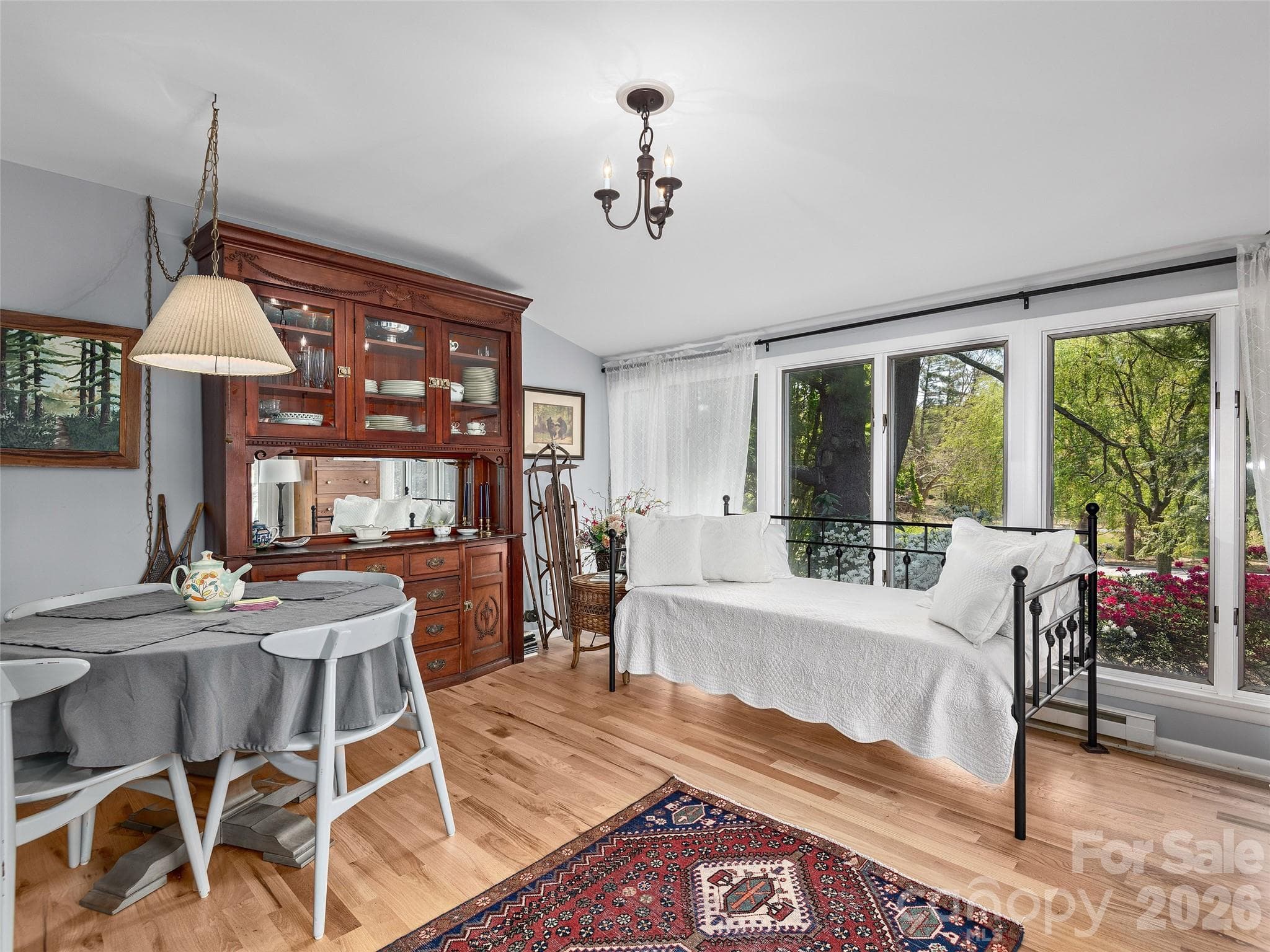 Day bed in Sunroom & view of azaleas. - 521 Crowfields Lane, Asheville