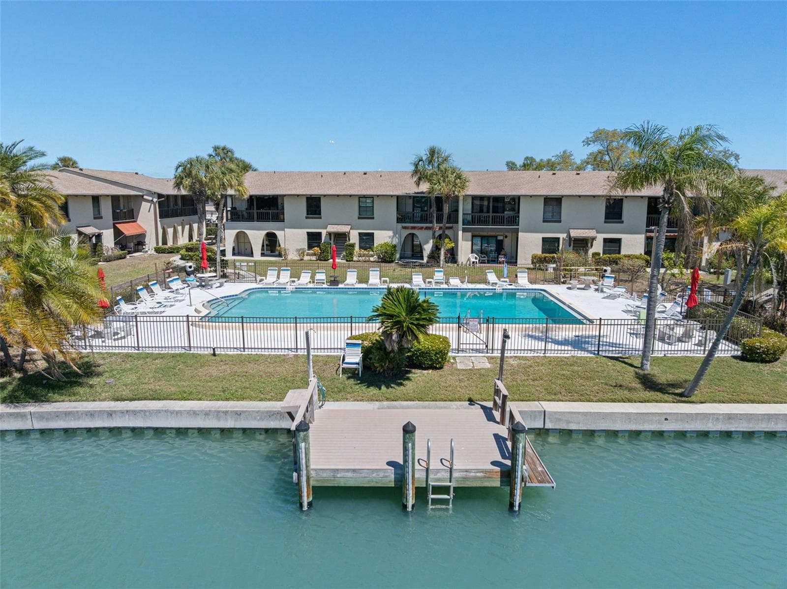 Waterfront community with heated pool, fishing pier & boat dock - just 1 mile to the Gulf beaches - 505 PLAZA SEVILLE CT #11, TREASURE ISLAND