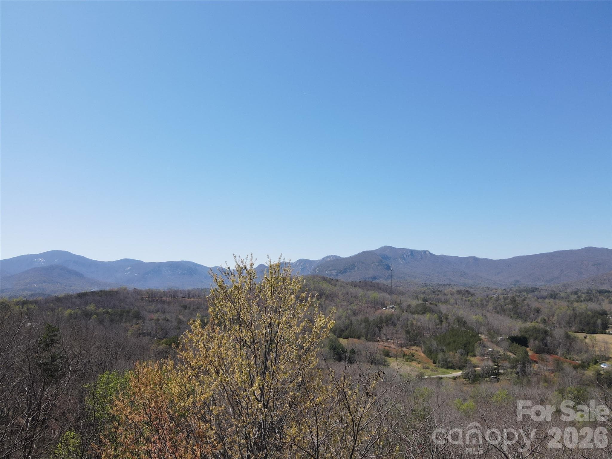 View to the approximate Northwest from Vista at Bills Mountain Lot 147 - #600 High Pines Loop. Taken from just above treetops at the road. - Lake Lure