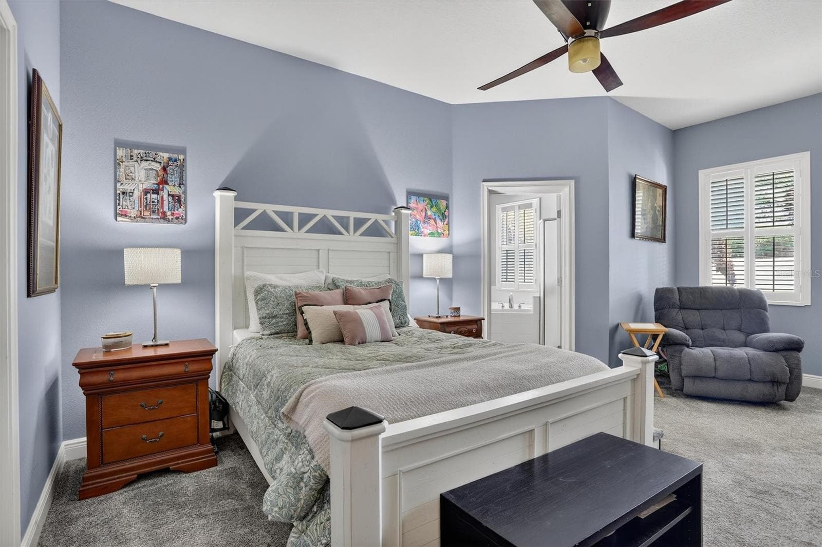 Oversized primary on the first floor with ensuite bath and door leading to lanai. - 416 MANNS HARBOR DR, APOLLO BEACH
