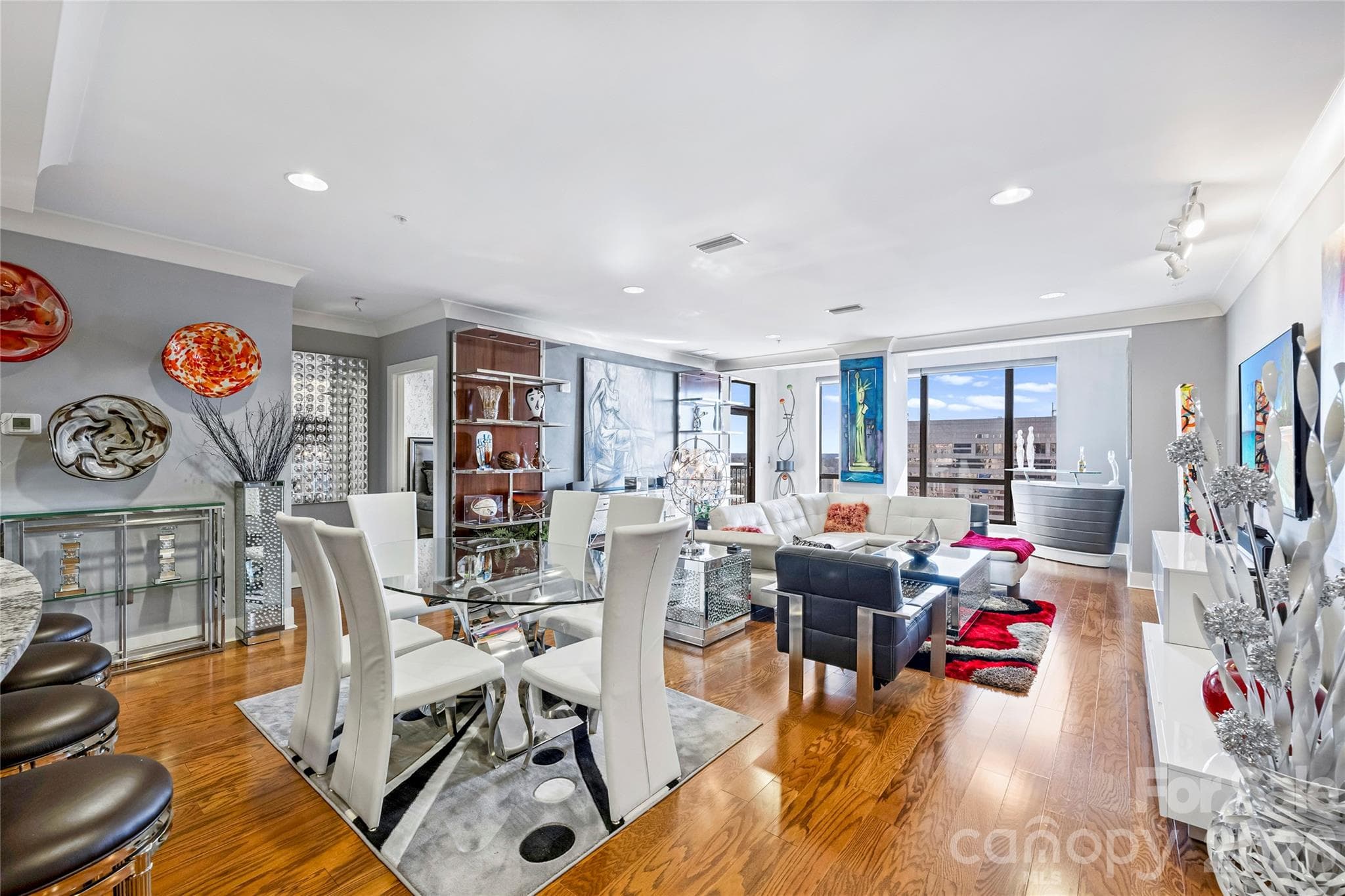 Bright and open living space with expansive windows and terrace access - 222 S Caldwell Street, Charlotte