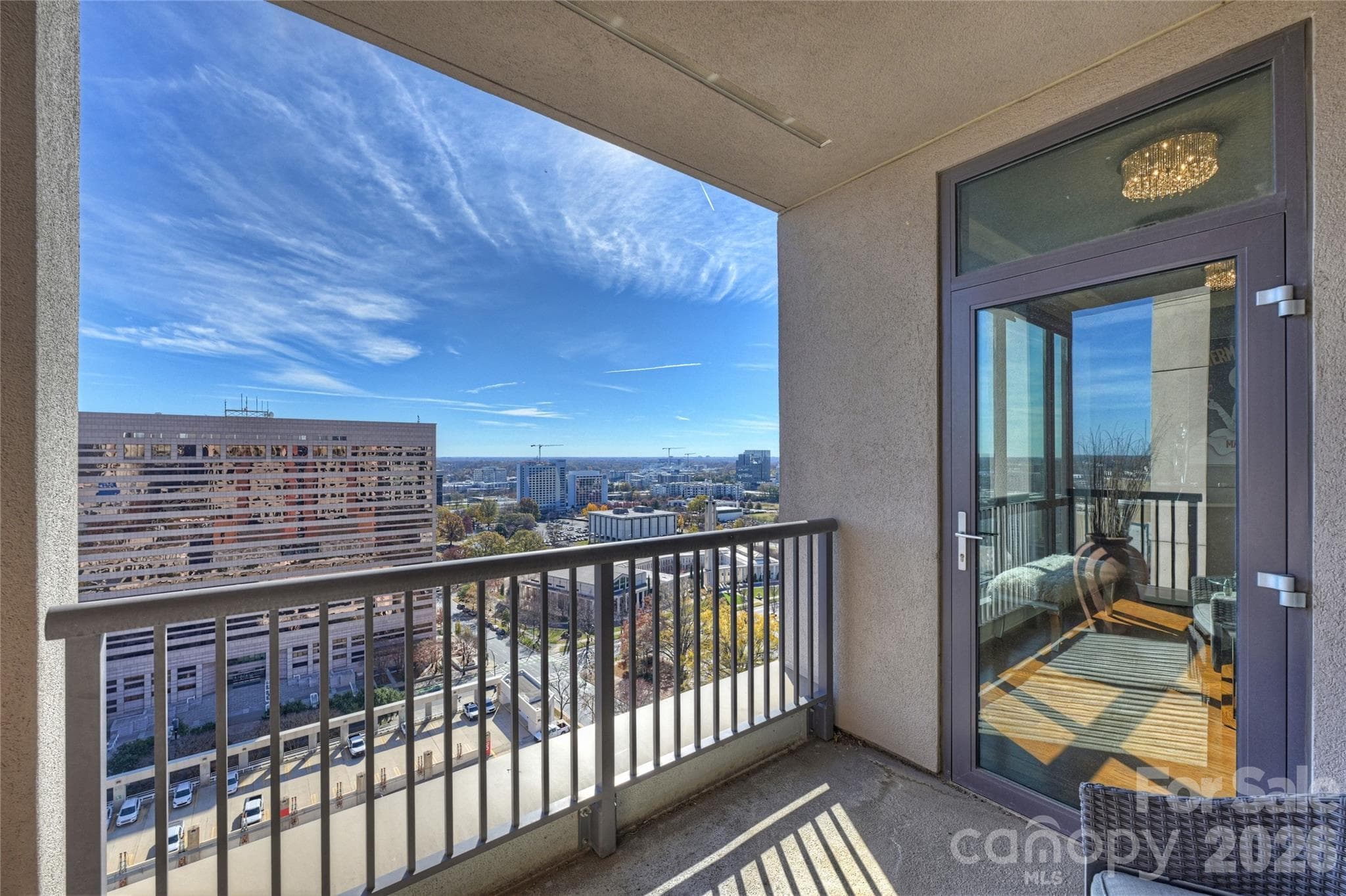 Private terrace off main living area — one of two outdoor spaces in this floorplan - 222 S Caldwell Street, Charlotte