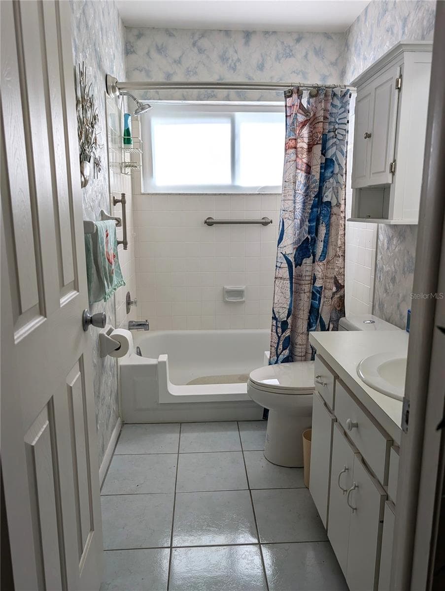 Tub has been converted into a walk-in shower for safer entry.  Grab bars installed for additional safety. - 9204 36TH WAY N #6, PINELLAS PARK