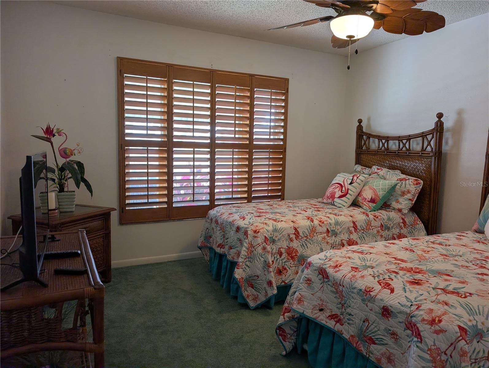 Guest bedroom features carpeting, ceiling fan and plantation shutters. - 9204 36TH WAY N #6, PINELLAS PARK
