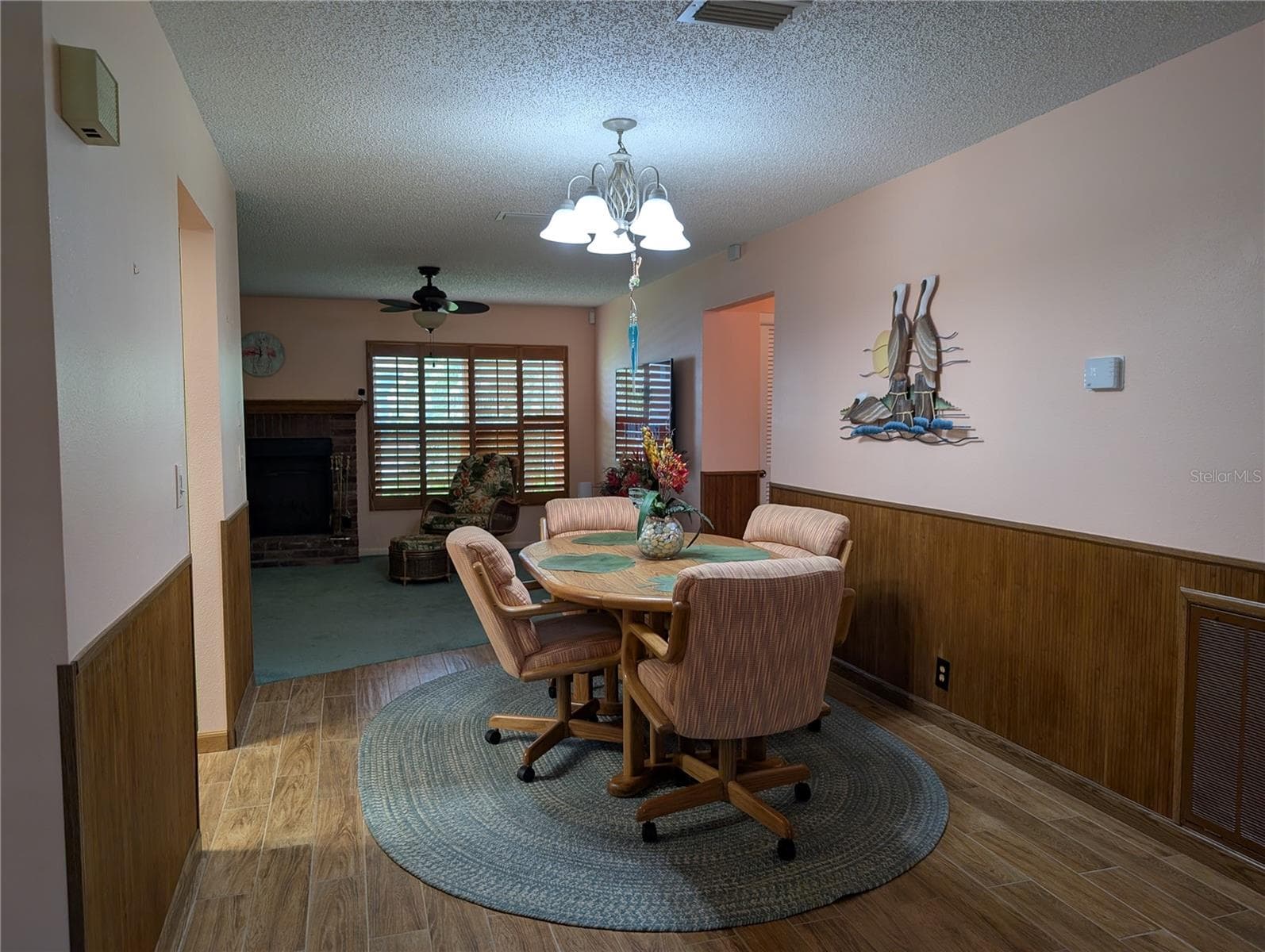 View from living room into dining room. Thermostat on right wall.  Kitchen is to the left. - 9204 36TH WAY N #6, PINELLAS PARK