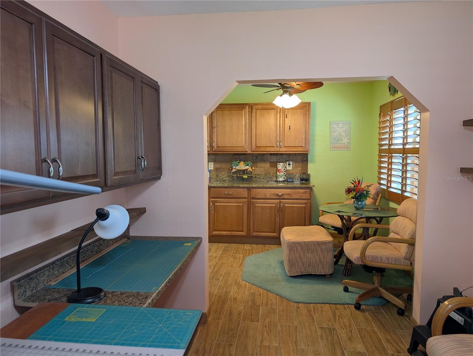View from Bonus room back to kitchen dinette area.  Kitchen remodel extended the cabinetry providing much more storage space and counterspace. - 9204 36TH WAY N #6, PINELLAS PARK