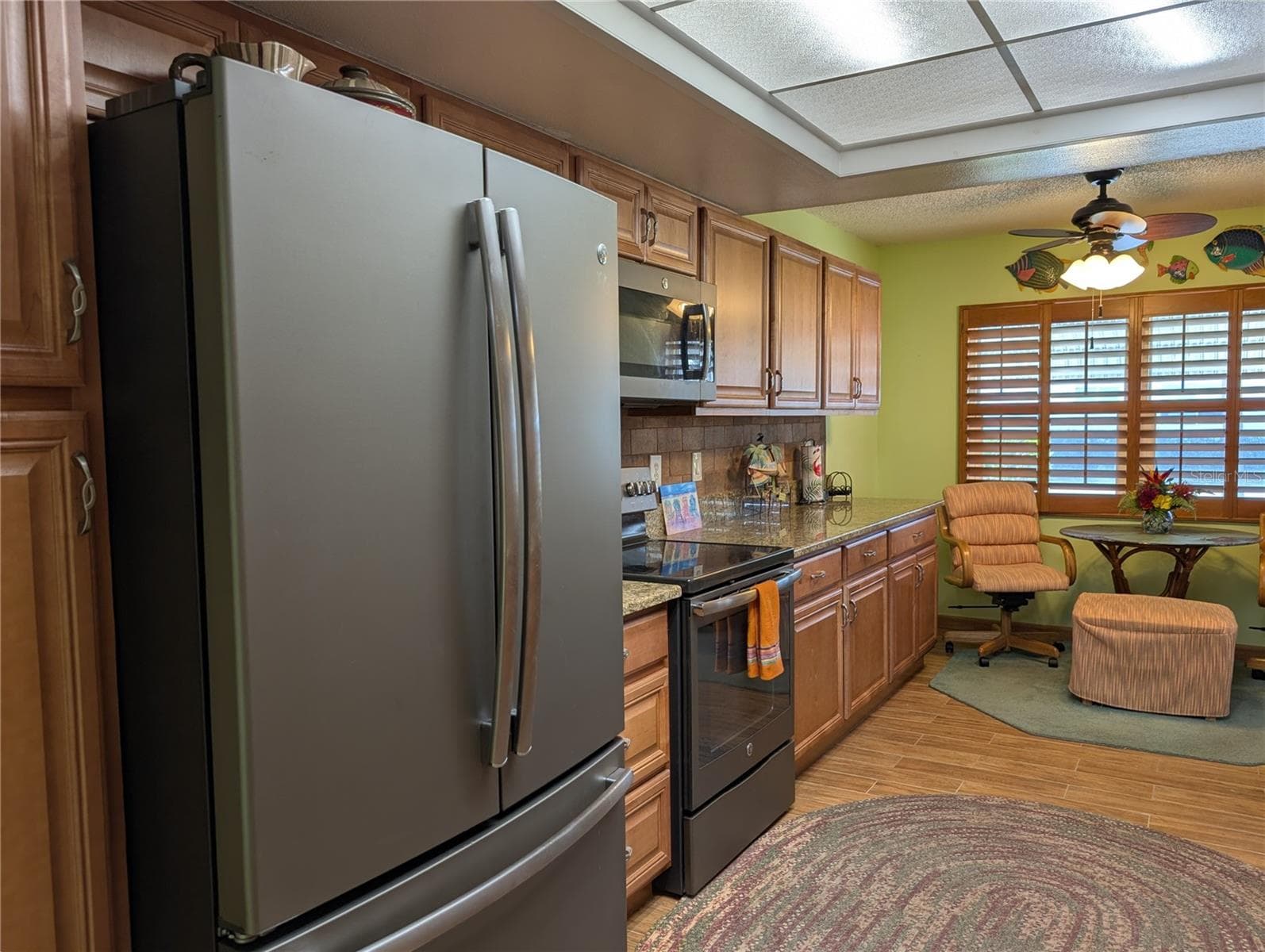 Closer view of the GE matching fingerprint resistant slate appliances w/satin finish handles. 1st Pantry is to left of frig. - 9204 36TH WAY N #6, PINELLAS PARK