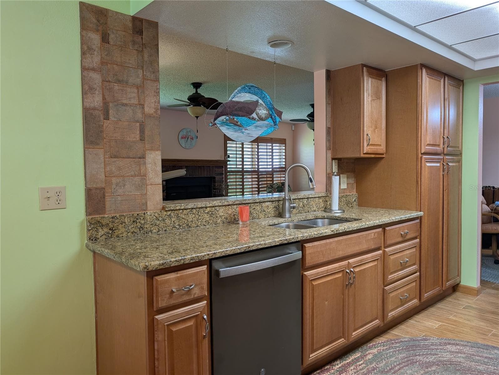 2nd pantry is across from frig.  View into Florida room. - 9204 36TH WAY N #6, PINELLAS PARK