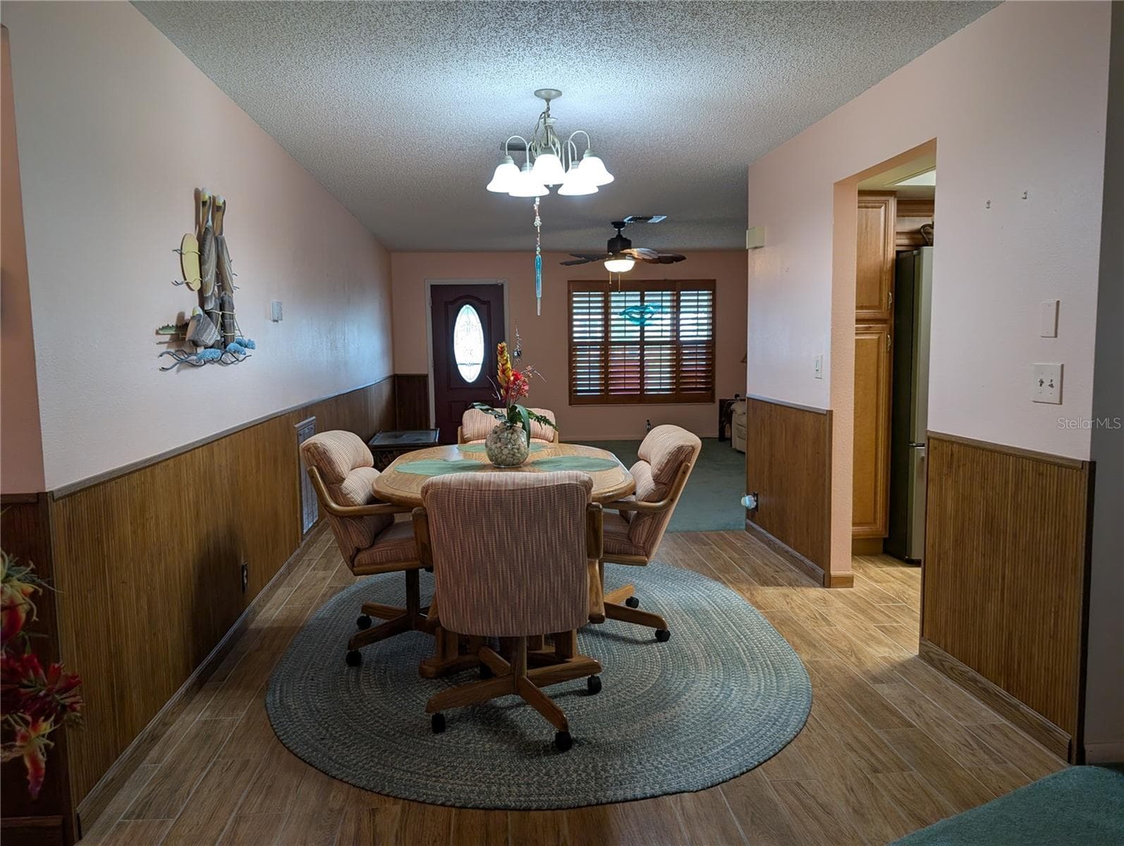 Leaving interior tour via hallway to front door.  Kitchen on right. - 9204 36TH WAY N #6, PINELLAS PARK