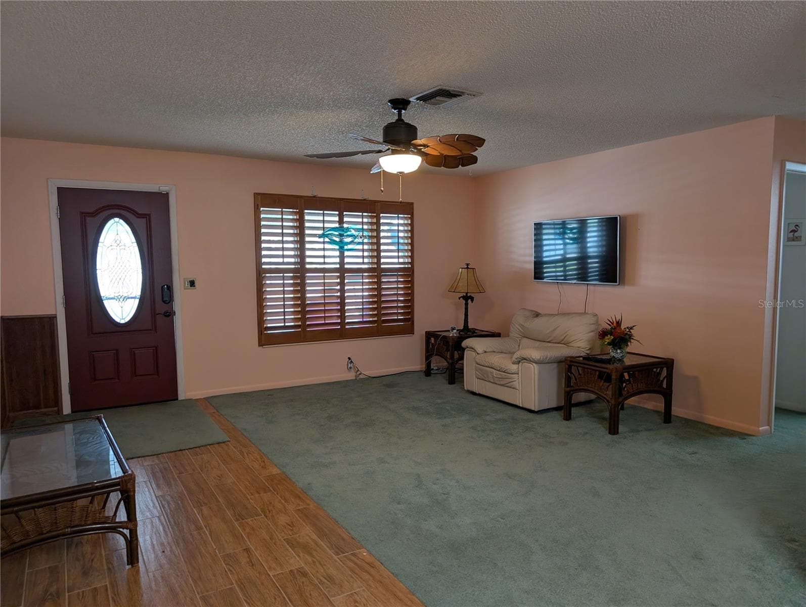 View of living room to front entry as we leave. LET'S TOUR THE EXTERIOR NEXT. - 9204 36TH WAY N #6, PINELLAS PARK