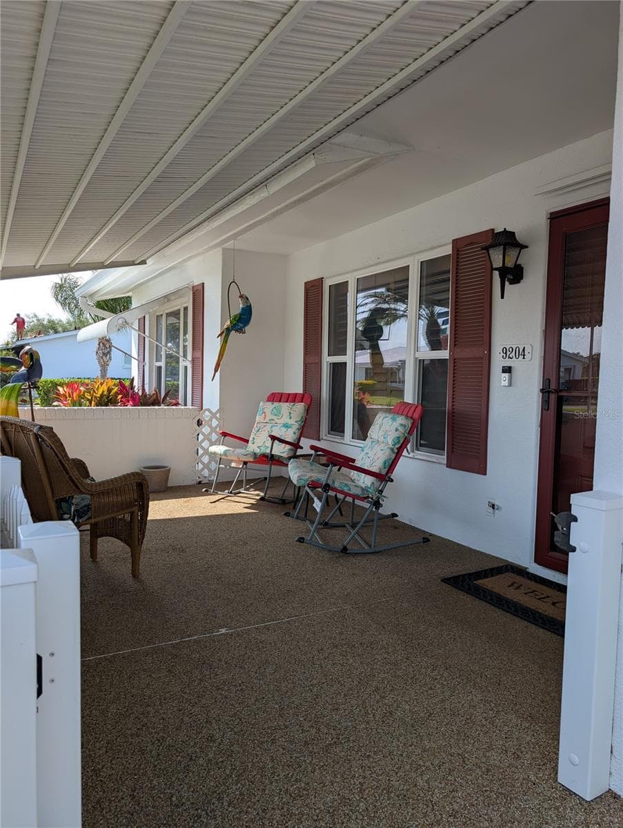 Pet friendly porch has a gate so your furry friends can sit outside with you. Windows are impact installed 2009. Ring doorbell (under address). - 9204 36TH WAY N #6, PINELLAS PARK