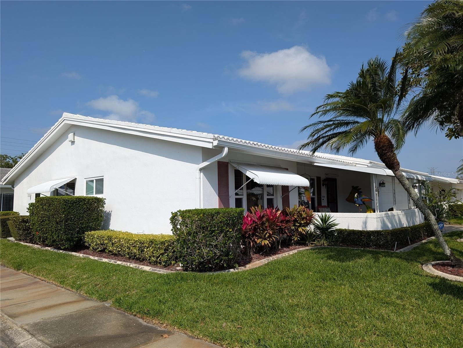 Front/side view from street corner. - 9204 36TH WAY N #6, PINELLAS PARK