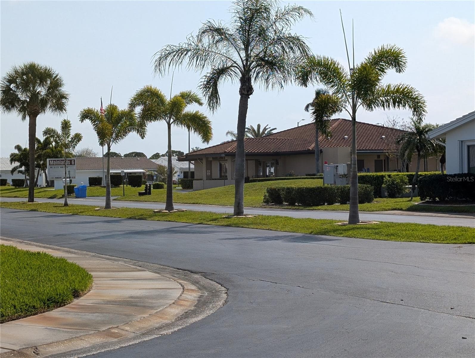 View from front yard to clubhouse across the street.  Conveniently located... just a short hop, skip or jump to any of the events or activities. - 9204 36TH WAY N #6, PINELLAS PARK